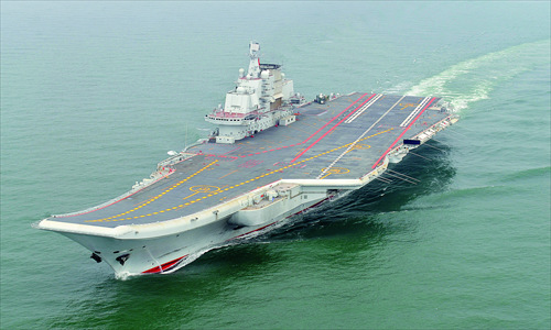 China's first aircraft carrier was delivered and commissioned to the People's Liberation Army Navy Tuesday. Photo: Xinhua