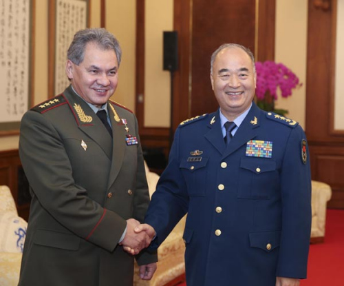 Xu Qiliang (R), vice chairman of the Central Military Commission of the Communist Party of China, meets with Russian Defense Minister Sergei Shoigu in Beijing, capital of China, Nov. 21, 2012. (Xinhua/Ding Lin)