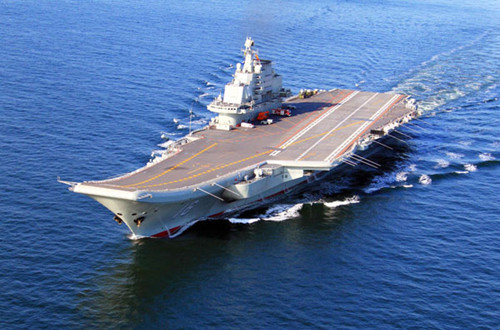 China's first aircraft carrier, the Liaoning, sails on the sea. China has conducted flight landing on its first aircraft carrier. [Undated photo/Xinhua]