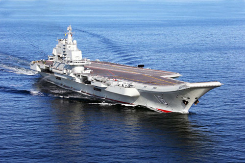 China's first aircraft carrier, the Liaoning, sails on the sea. China has conducted flight landing on its first aircraft carrier. [Undated photo/Xinhua]