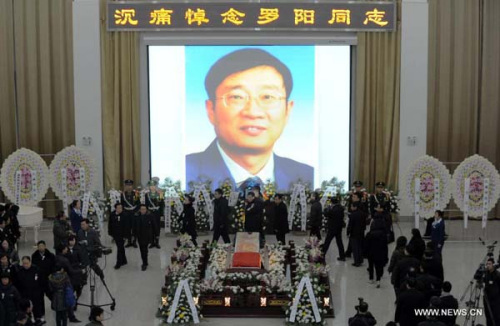 People attend a memorial service for Luo Yang, head of the production phase for China's new J-15 fighter jet, who died of a heart attack on Nov. 25, in the Huilonggang Cemetery for Revolutionaries in Shenyang, capital of northeast China's Liaoning Province, Nov. 29, 2012. Luo experienced a heart attack after observing aircraft carrier flight landing tests for China's first aircraft carrier, the Liaoning, on Nov. 25. He later died in hospital at the age of 51. He was also chairman and general manager of Shenyang Aircraft Corp. (SAC), a subsidiary of China's state-owned aircraft maker, Aviation Industry Corp. of China (AVIC). (Xinhua/Yang Qing)