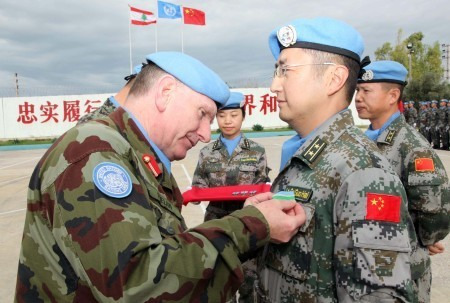 The officer is honored with the United Nations Medal of Peace.(Xinhua/Liu Shun)