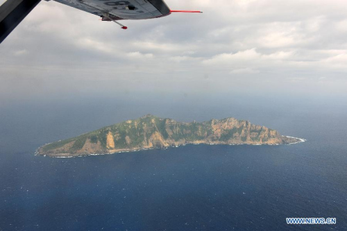 Photo taken on a marine surveillance plane B-3837 on Dec. 13, 2012 shows the Diaoyu Islands and nearby islands. A Chinese marine surveillance plane was sent to join vessels patrolling the territorial waters around the Diaoyu Islands on Thursday morning, according to China's maritime authorities. (Xinhua)