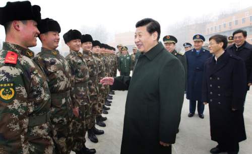 Xi Jinping (C, front), general secretary of the Central Committee of the Communist Party of China (CPC) and also chairman of the CPC Central Military Commission, talks with members of the 13th detachment of the Beijing contingent of Chinese People's Armed Police Force in Beijing, capital of China, Jan. 29, 2013. Xi made an inspection tour in the armed police forces in Beijing on Tuesday to convey festival greetings to the nation's armed policemen on behalf of the CPC Central Committee, the State Council and the Central Military Commission. (Xinhua/Li Gang)