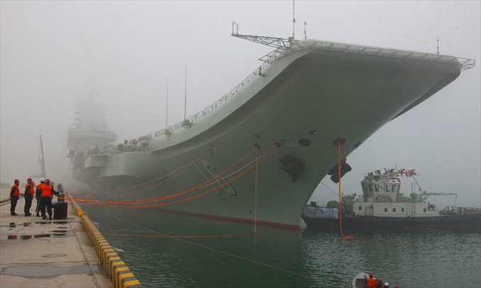 China's first aircraft carrier, the Liaoning, anchores at its homeport in Qingdao, east China's Shandong Province, Feb. 27, 2013. It is the first time for the aircraft carrier to anchor at its homeport, meaning that the naval base for aircraft carrier in Qingdao is operational after four years of construction, according to a People's Liberation Army Navy statement. Photo: Xinhua 