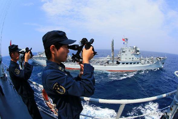 The destroyer Shenyang and comprehensive supply ship Hongze Lake are seen during Sino-Russian joint naval drills held in the sea of Japan, July 4, 2013. Chinese and Russian armed forces will take part in the Joint Sea-2013 drill in Peter the Great Bay from July 5 to July 12, and a joint anti-terrorism drill, Peace Mission-2013, will be held in Russia's Chelyabinsk from July 27 to August 15. [Xinhua]