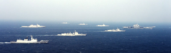 Group sailing: A picture released on Wednesday shows the Liaoning carrier battle group as the nation's first aircraft carrier returns to its home port of Qingdao in Shandong province. LI JING / FOR CHINA DAILY