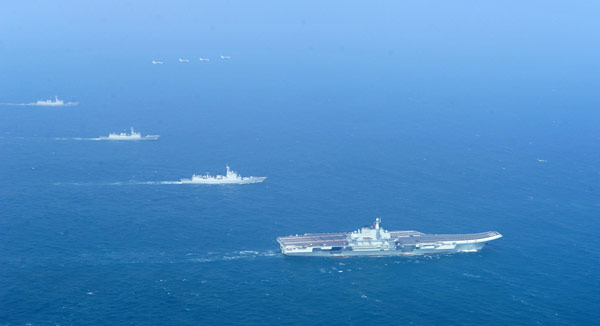 A picture released on Wednesday shows the Liaoning carrier battle group as the nation's first aircraft carrier returns to its home port of Qingdao in Shandong province. Hu Kaibing/ FOR CHINA DAILY