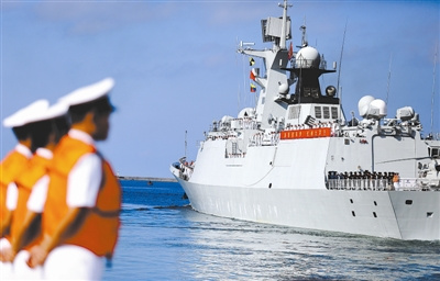 The guided-missile frigate Sanya sets sail from a naval port in Sanya of the Hainan province on the morning of August 4, 2015.