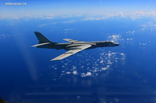 A bombardment aircraft participates a drill of China air force in the western Pacific, Aug. 14, 2015. The People's Liberation Army (PLA) Air Force conducted a drill involving multiple types of aircraft in the western Pacific on Friday.   (Photo: Xinhua/Feng Xiang)