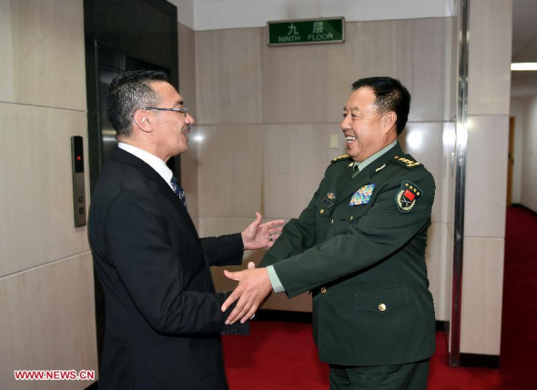 Vice chairman of China's Central Military Commission Fan Changlong shakes hands with Malaysian Defense Minister Hishammuddin Hussein in Beijing, China, Oct. 15, 2015. (Photo: Xinhua/Zhang Ling)