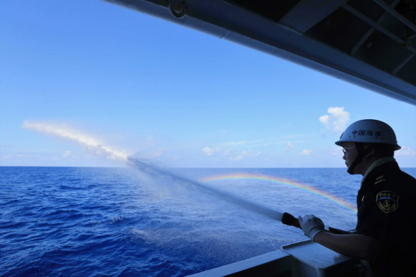 A sailor is taking part in the fire drill on the Chinese patrol vessel Haixun 01 on April 8, 2016 in the South China Sea. (Photo/Xinhua)