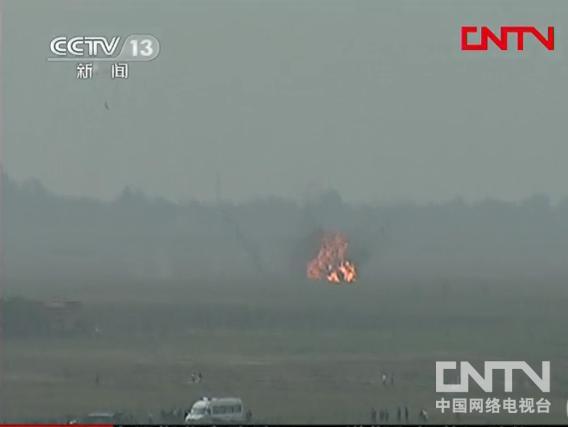  The image captured from CNTV live footage shows the aircraft crash scene. 