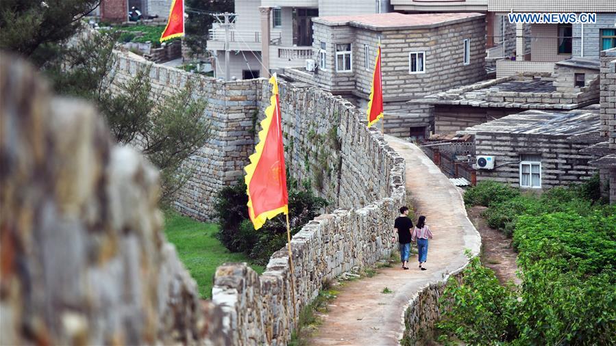 Chongwu ancient town, a stone town, was one of the over 60 defense fortresses built in Ming dynasty (1368-1644) along China's coast. It also features widely known cultural folk custom of the Hui'an Maiden.