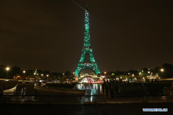 The Eiffel Tower is lit in green in Paris, France on Nov. 4, 2016 to celebrate the entry into force of the Paris Agreement on climate change.