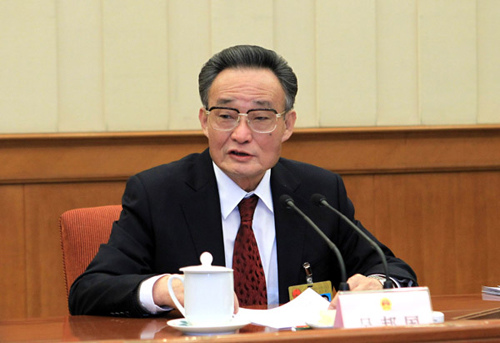 Wu Bangguo, chairman of the Standing Committee of China's National People's Congress (NPC), presides over a plenary meeting of the 24th session of the 11th NPC Standing Committee in Beijing, capital o