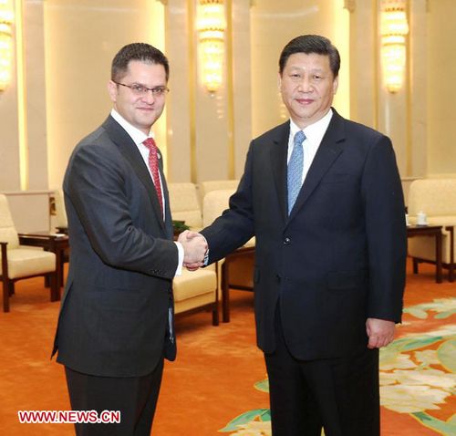 Xi Jinping (R), general secretary of the Communist Party of China (CPC) Central Committee, shakes hands with Vuk Jeremic, president of the 67th Session of the UN General Assembly, in Beijing, capital of China, Dec. 27, 2012. (Xinhua/Liu Weibing)