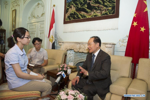 Chinese special envoy to the Middle East Wu Sike (R) speaks during an interview in Chinese Embassy in Cairo, Egypt, June 3, 2013. (Xinhua/Li Muzi)