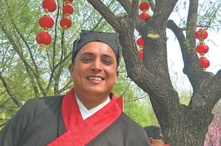 <b>Yunus Kemp</b> dresses in traditional Chinese clothing.