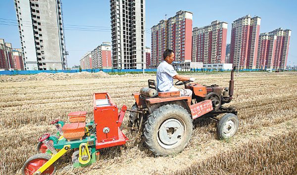 New buildings in Huaxian county, Henan province. Urbanization will play an active role in keeping the country's investment and rowth stable. Wang Zirui / For China Daily