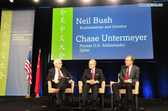 Charles Foster (L), chairman of U.S.-China Partnership and former chairman of Asia Society Texas Center, Chase Untermeyer (C), former U.S. Ambassador to Qatar, and Neil Bush, the son and private representative to former U.S. President George H. W. Bush discuss during the National Chinese Language Conference 2017 in Houston, the United States, April 7, 2017. (Xinhua/Zhang Yongxing)