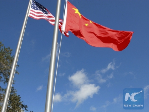 File photo: The Chinese and American flags are being raised at the Chinese Civic Center in Houston, the United States, on Sept. 25, 2011. (Xinhua/Song Qiong)